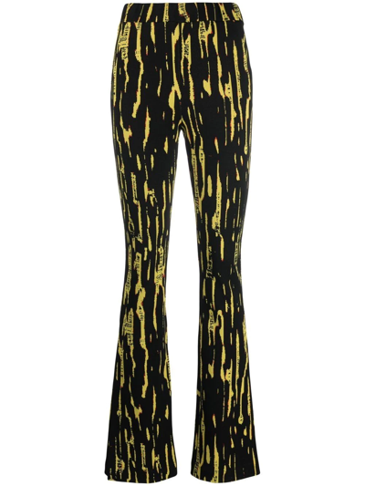 Ambush Graphic Printed Slit Flared Pants In Schwarz