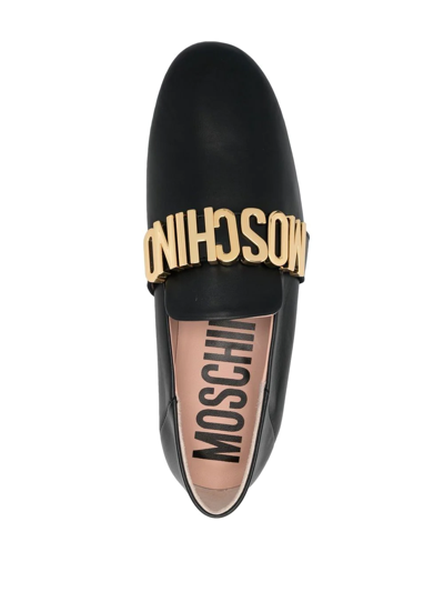 Shop Moschino Logo Lettering Loafers In Schwarz