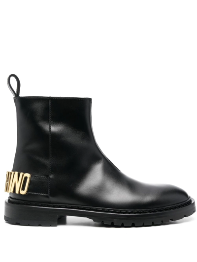 Shop Moschino Logo-lettering Boots In Schwarz