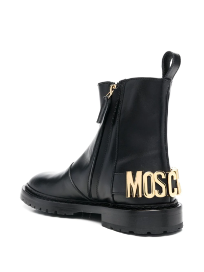 Shop Moschino Logo-lettering Boots In Schwarz