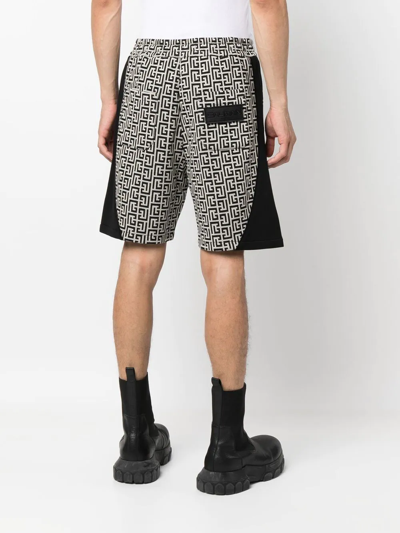 Shop Balmain All-over Monogram-print Shorts In Schwarz