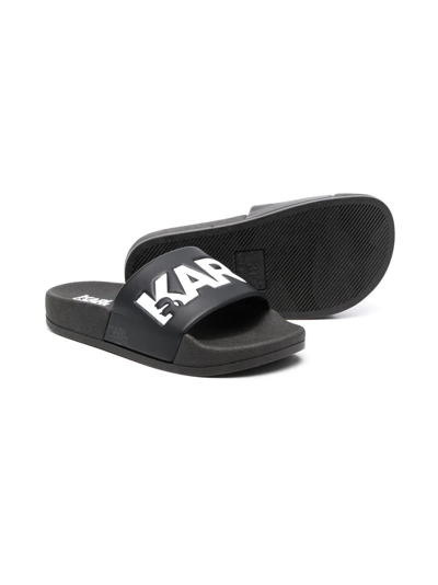 Shop Karl Lagerfeld Logo-print Flat Slides In 黑色