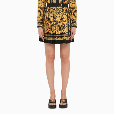 Shop Versace | Black And Gold Pleated Silk Mini Skirt In ["multicolor"/ "print"/ "yellow"]
