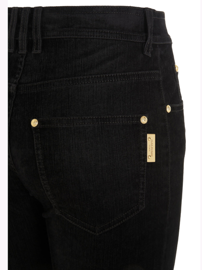 Shop Balmain Logo Button Jeans In Black