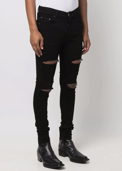 Shop Amiri Black Thrasher Plus Jeans