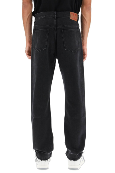 Shop Valentino Straight Jeans With Unstitched Hem In Black