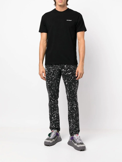 Off-white Man Black Skinny Jeans With Paint Effect Print In Schwarz