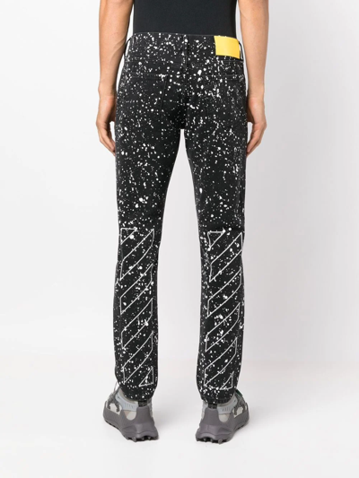 Off-white Man Black Skinny Jeans With Paint Effect Print In Schwarz