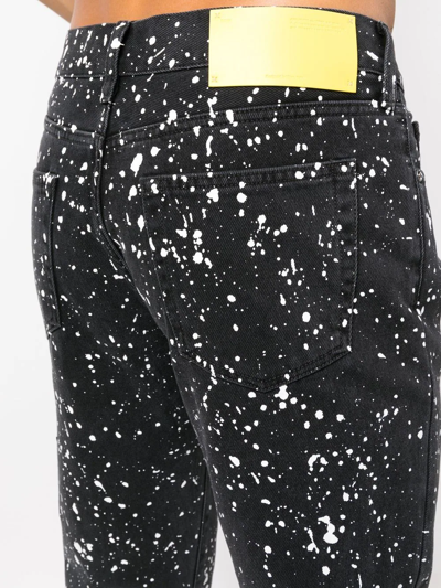 Off-white Man Black Skinny Jeans With Paint Effect Print In Schwarz