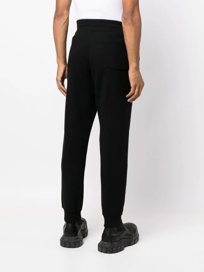 Shop Moschino Slim-cut Track Pants In Schwarz