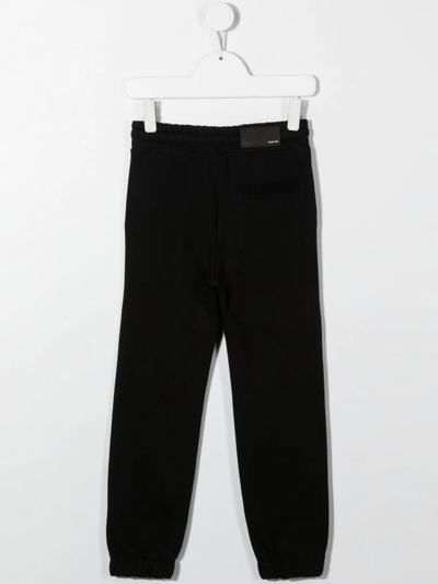 Shop Amiri Elasticated Jogging Trousers In 黑色