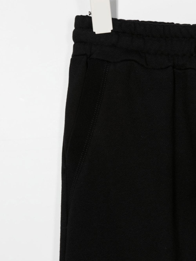 Shop Amiri Elasticated Jogging Trousers In 黑色