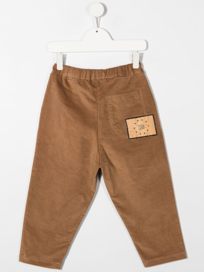 Shop Douuod Logo-patch Velvet Trousers In 褐色