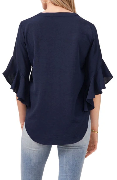 Shop Vince Camuto Flutter Sleeve Henley Blouse In Classic Navy