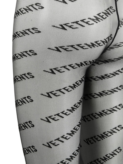 Shop Vetements Logo-print Semi-sheer Tights In Black