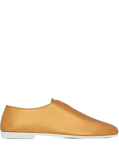 Shop Saint Laurent Boy Leather Loafers In Gold
