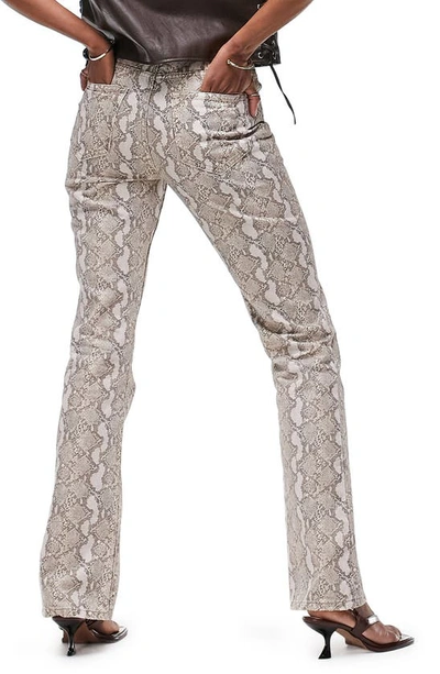 Shop Asos Design Snake Print Flare Leg Jeans In White Multi