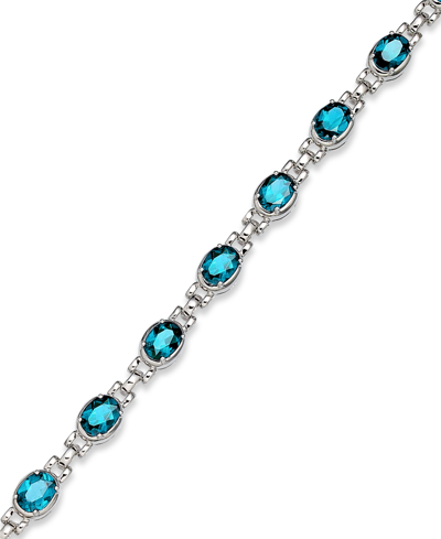 Shop Macy's Blue Topaz (13 Ct. T.w.) Oval Link Bracelet In Sterling Silver (also In Mystic Topaz)