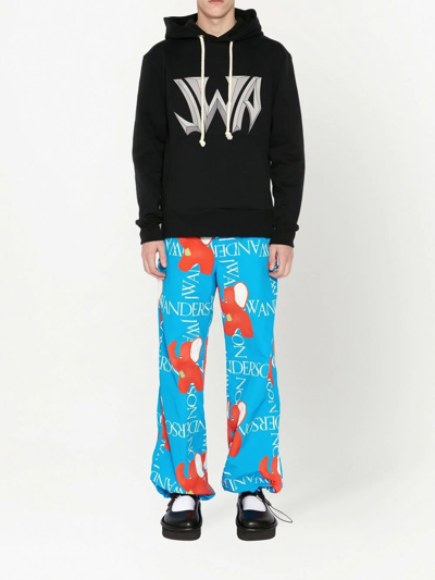 Shop Jw Anderson Logo-print Wide-leg Trousers In Blue