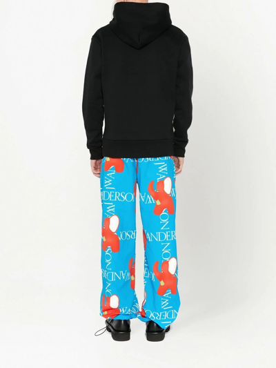 Shop Jw Anderson Logo-print Wide-leg Trousers In Blue