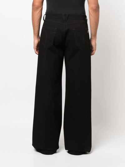 Shop Versace Wide-leg Cotton Trousers In Schwarz