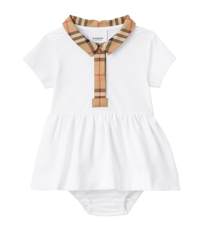 Shop Burberry Kids Check Trim Dress (1-18 Months) In White