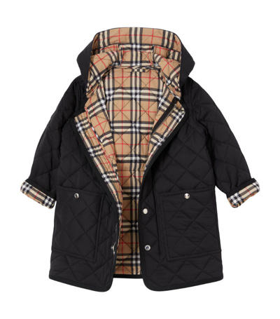 Shop Burberry Quilted Hooded Coat (3-14 Years) In Black