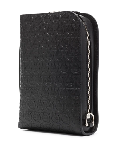 Shop Ferragamo Gancini-embossed Messenger Bag In Schwarz