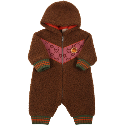 Shop Gucci Brown Jumpsuit For Baby Girl With Hearts, Stars And Logo