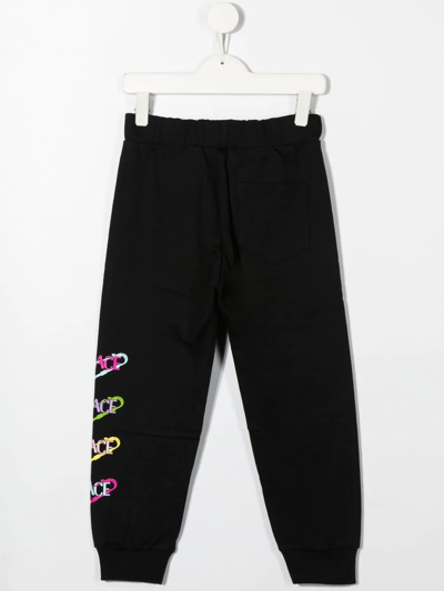 Shop Versace Logo-print Cotton Track Pants In 黑色