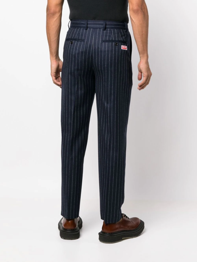 Shop Kenzo Tapered Pinstripe-print Trousers In 蓝色