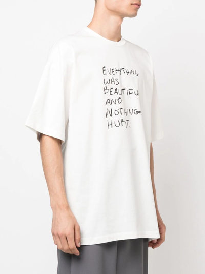 Shop Oamc Slogan-print Cotton T-shirt In Weiss