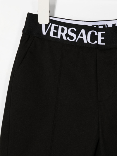 Shop Versace Logo-waistband Straight Trousers In Black