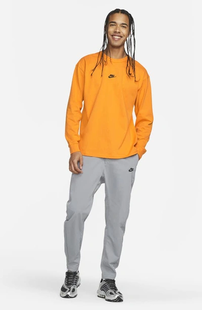 Shop Nike Sportswear Premium Essentials Long Sleeve T-shirt In Kumquat/ Black