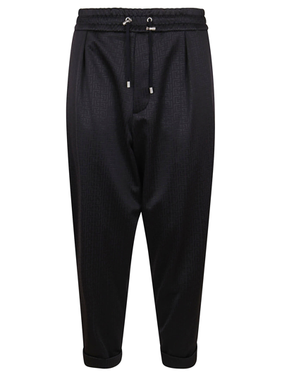 Shop Balmain Slouchy Monogram Jersey Pants In Eap Noir Noir