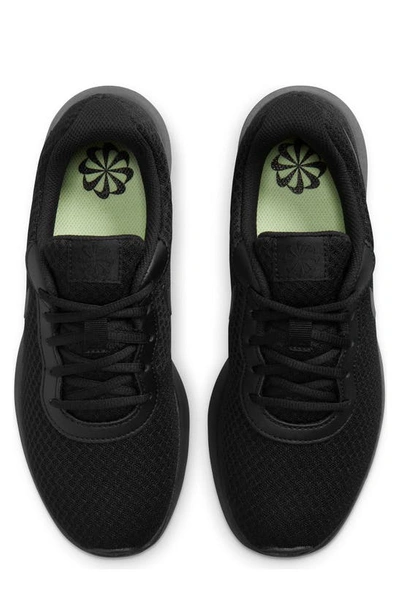 Shop Nike Tanjun Running Shoe In Black/black-barely Volt