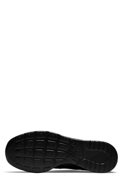 Shop Nike Tanjun Running Shoe In Black/black-barely Volt