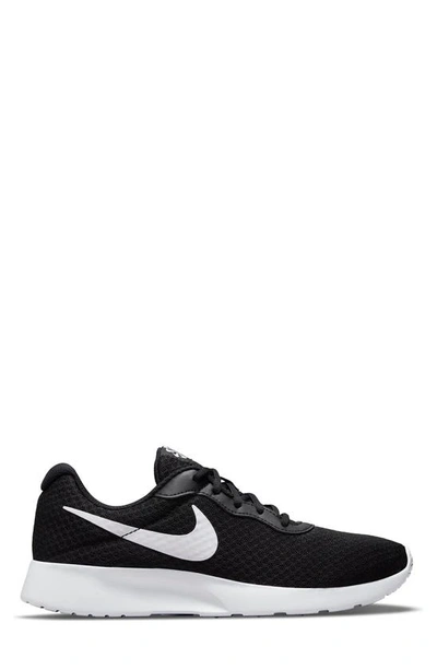 Shop Nike Tanjun Running Shoe In Black/white