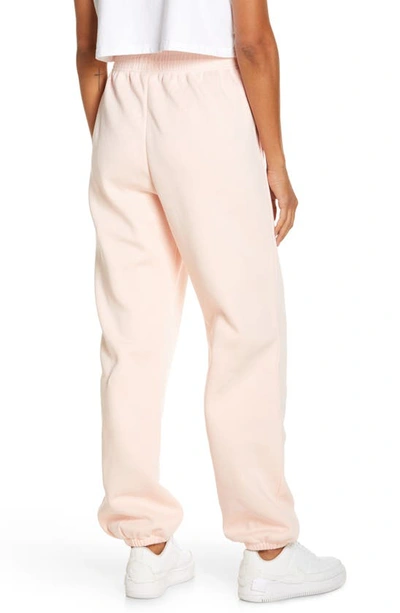 Shop Nike Sportswear Essential Fleece Pants In Atmosphere/ White