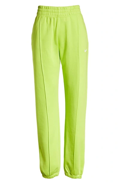 Shop Nike Sportswear Essential Fleece Pants In 321 Atomic Green/ White