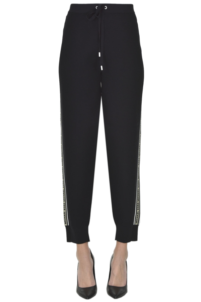Shop Michael Michael Kors Textured Fabric Jogger Trousers In Black