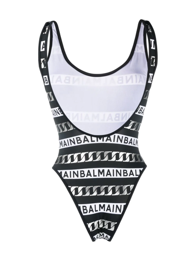Shop Balmain Striped Logo-print Swimsuit In Schwarz