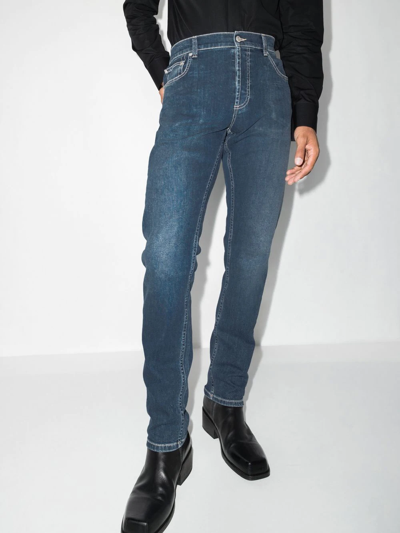 Shop Alexander Mcqueen Embroidered-logo Straight-leg Jeans In Blue
