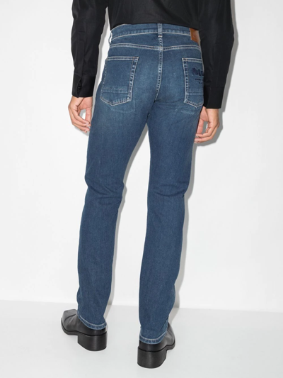 Shop Alexander Mcqueen Embroidered-logo Straight-leg Jeans In Blue