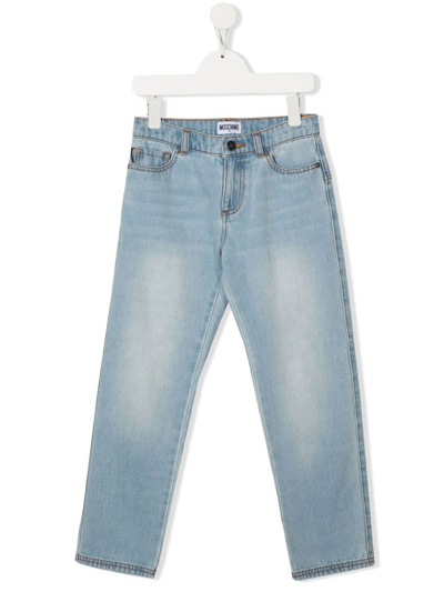 Shop Moschino Logo-patch Slim-cut Jeans In Blue