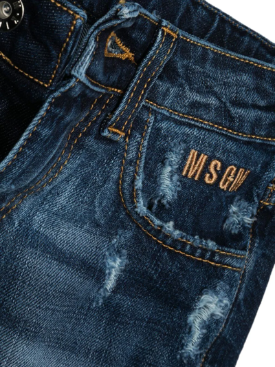 Shop Msgm Embroidered-logo Distressed-finish Jeans In Blue