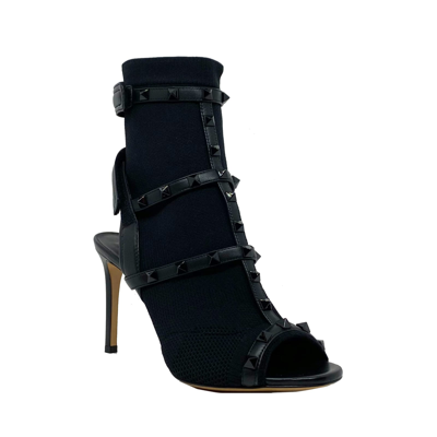 Shop Valentino Rockstud Sock Heel Sandals In Black