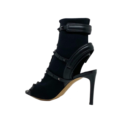 Shop Valentino Rockstud Sock Heel Sandals In Black