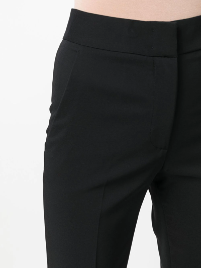 Shop Genny Flared High-waist Trousers In Black