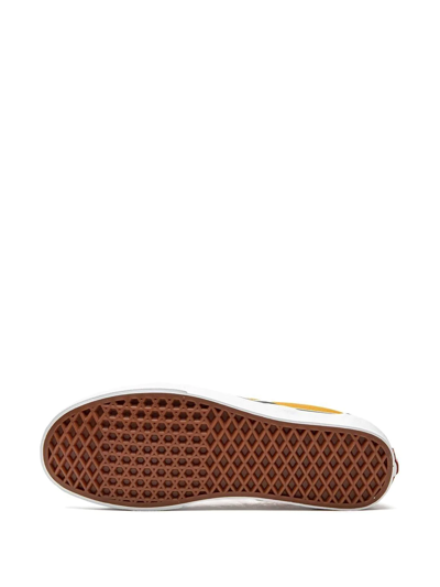 Shop Vans Slip-on Sneakers In Gold